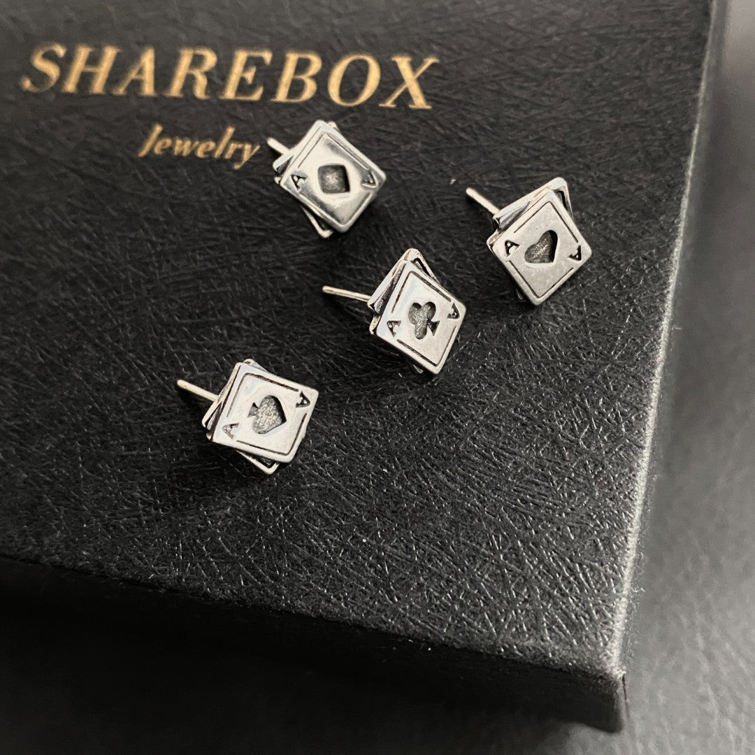 Detailed view of 8.5mm by 10mm ace poker .925 sterling silver stud earrings featuring spade, clubs, diamonds, and heart designs