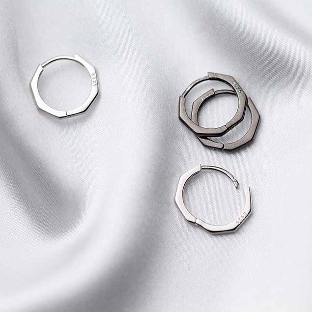 Detailed view of 13mm octagon .925 sterling silver hoop earrings showing geometric shape and polished finish
