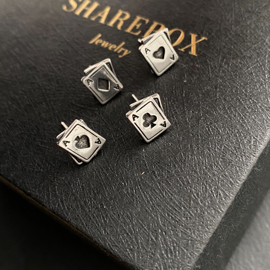 Detailed view of 8.5mm by 10mm ace poker .925 sterling silver stud earrings featuring spade, clubs, diamonds, and heart designs