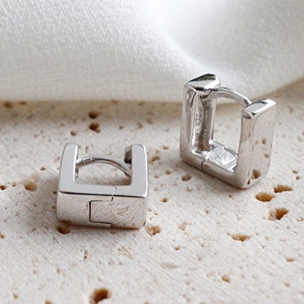 Close-up of hollow square .925 sterling silver hoop earrings in 5mm and 6mm sizes.