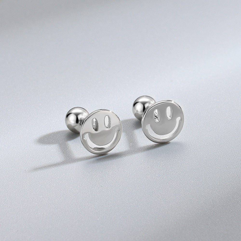 Detailed view of 7mm happy smile .925 sterling silver screw stud earrings showing playful design and polished finish
