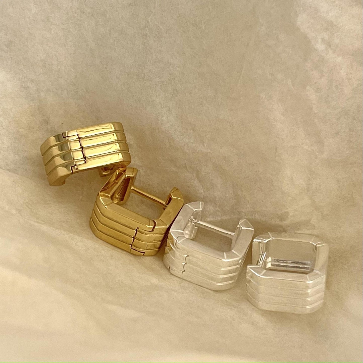 Detailed view of hollow square .925 sterling silver hoop earrings showing lightweight design and polished finish