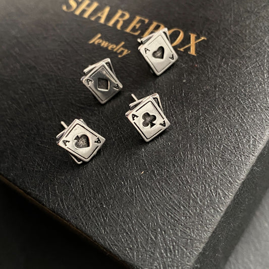 Detailed view of 8.5mm by 10mm ace poker .925 sterling silver stud earrings featuring spade, clubs, diamonds, and heart designs