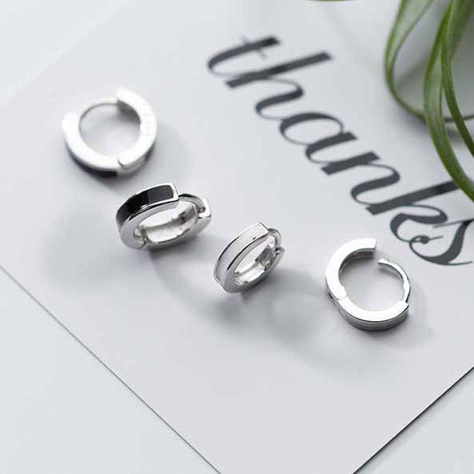Detailed view of 2mm and 3mm circle .925 sterling silver hoop earrings showing sleek design and polished finish