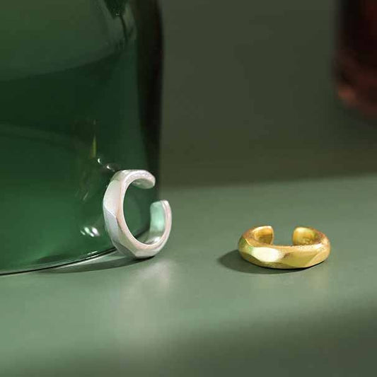 Detailed view of 10.5mm circle sterling silver non-pierced earring showing polished finish