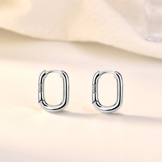 Detailed view of 14mm by 11mm hollow rectangle .925 sterling silver hoop earrings showing lightweight design and polished finish