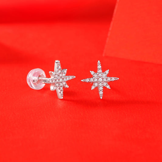 Detailed view of 10mm meteor star .925 sterling silver stud earrings showing textured design and polished finish