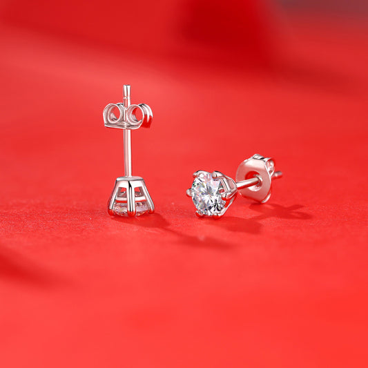 Detailed view of 7.5mm six claw moissanite .925 sterling silver stud earrings showing brilliant cut and polished finish