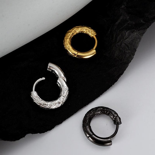 Detailed view of 10mm wrinkled .925 sterling silver hoop earrings showing textured surface and polished finish