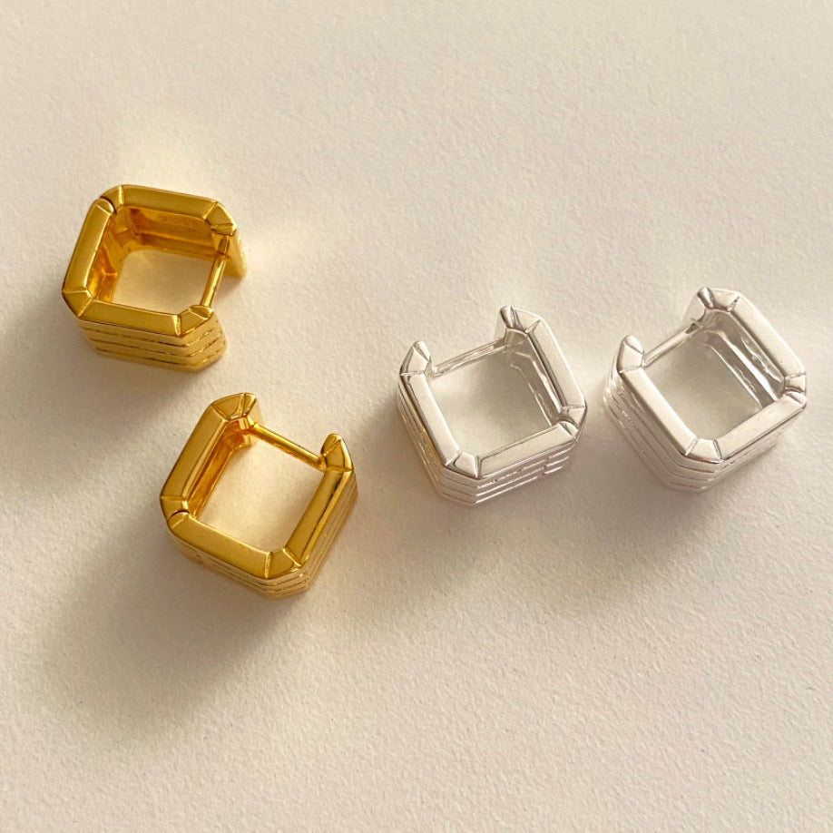 Detailed view of hollow square .925 sterling silver hoop earrings showing lightweight design and polished finish