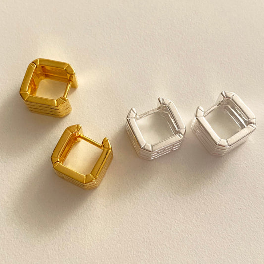Detailed view of hollow square .925 sterling silver hoop earrings showing lightweight design and polished finish