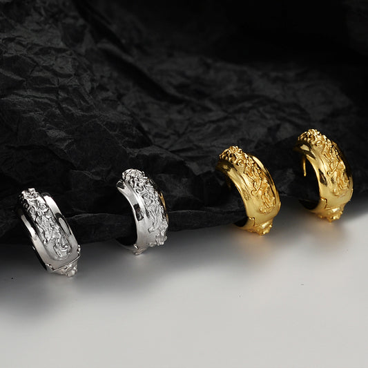 Detailed view of 12mm irregular surface .925 sterling silver hoop earrings showing organic texture and polished finish