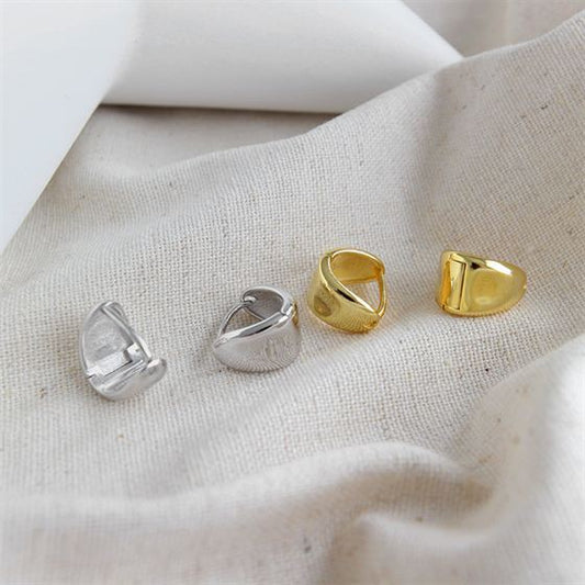 Detailed view of 8.6mm triangle .925 sterling silver leverback earrings showing geometric shape and polished finish