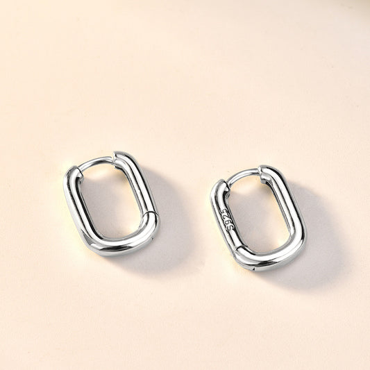 Detailed view of 14mm by 11mm hollow rectangle .925 sterling silver hoop earrings showing lightweight design and polished finish