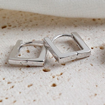 Close-up of hollow square .925 sterling silver hoop earrings in 5mm and 6mm sizes.